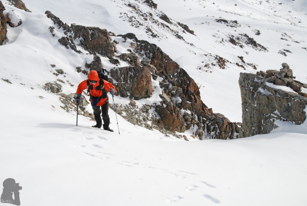 The route became steeper with hard snow while approaching the saddle.