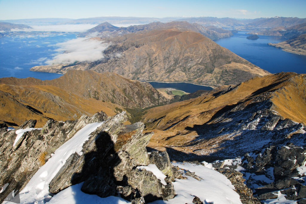 Sentinel Peak, the Summit on the Serrated Ridge Overlooks Lake Hāwea and Lake Wānaka At the top of Sentinel Peak; my shadow had a selfie together with Lake Hāwea, Lake Wānaka and Isthmus Peak in the middle.