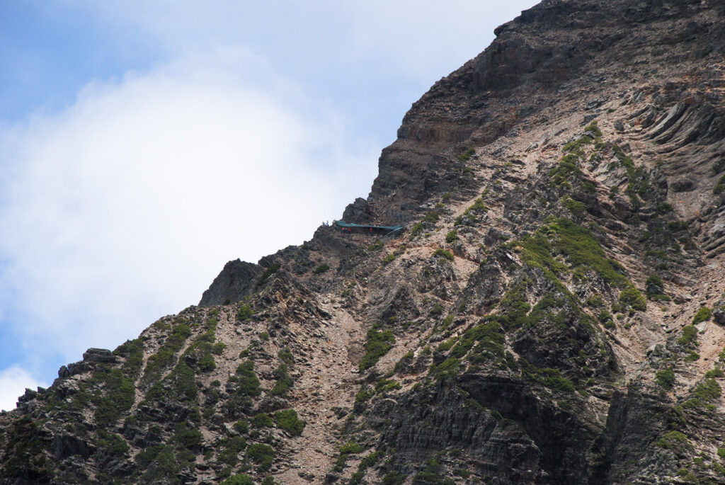 The “cage tunnel” protects hikers from frequent rockfalls and prolongs the lifespan of the trail too.