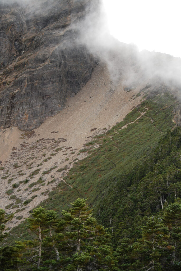 The trail zigzags back to the shoulder of Yushan Main Peak, an altitude debt hikers must pay off.