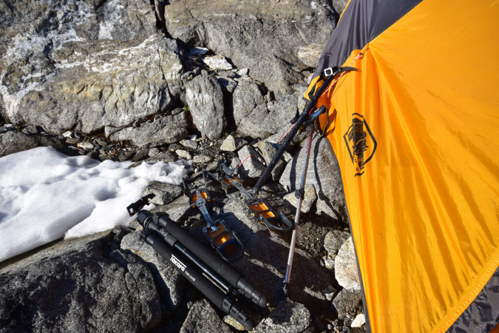 A camp near Barrier Knob; overlooking the dreamy Gertrude Valley and Lake Adelaide gears for hiking and a tripod