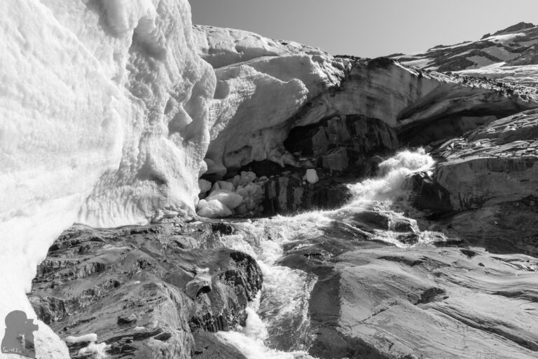 In front of the “ice cave” of Brewster Glacier