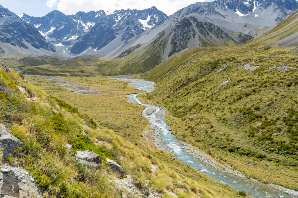 Cameron Hut, a Strenuous Hike to the Remotest Hut in Canterbury The destination is getting closer; Cameron Hut is hidden behind one of the mounds.