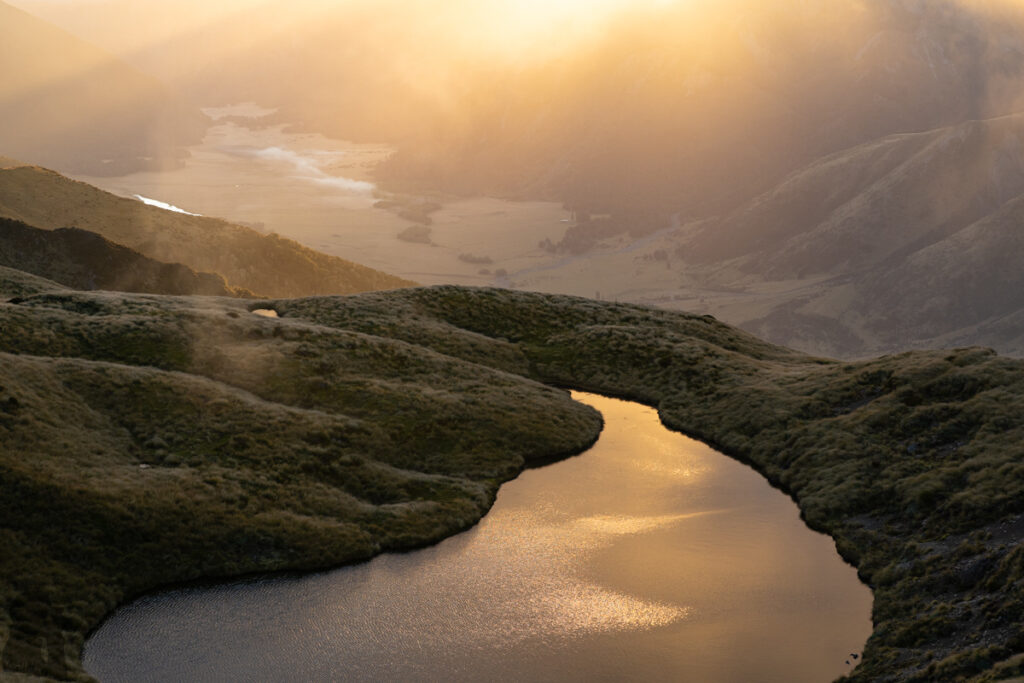 Faust, Libretto Range, Camp by its Colorful Tarns on the Ridge Sun dyed a tarn golden.