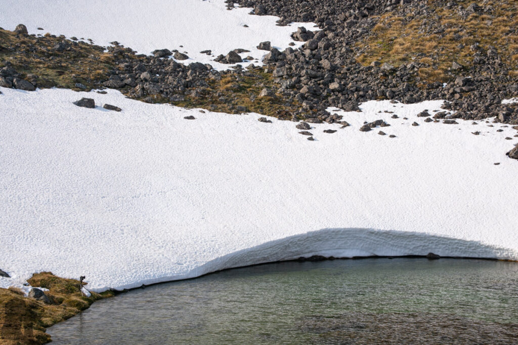 Faust, Libretto Range, Camp by its Colorful Tarns on the Ridge Thick snow remained in early spring.