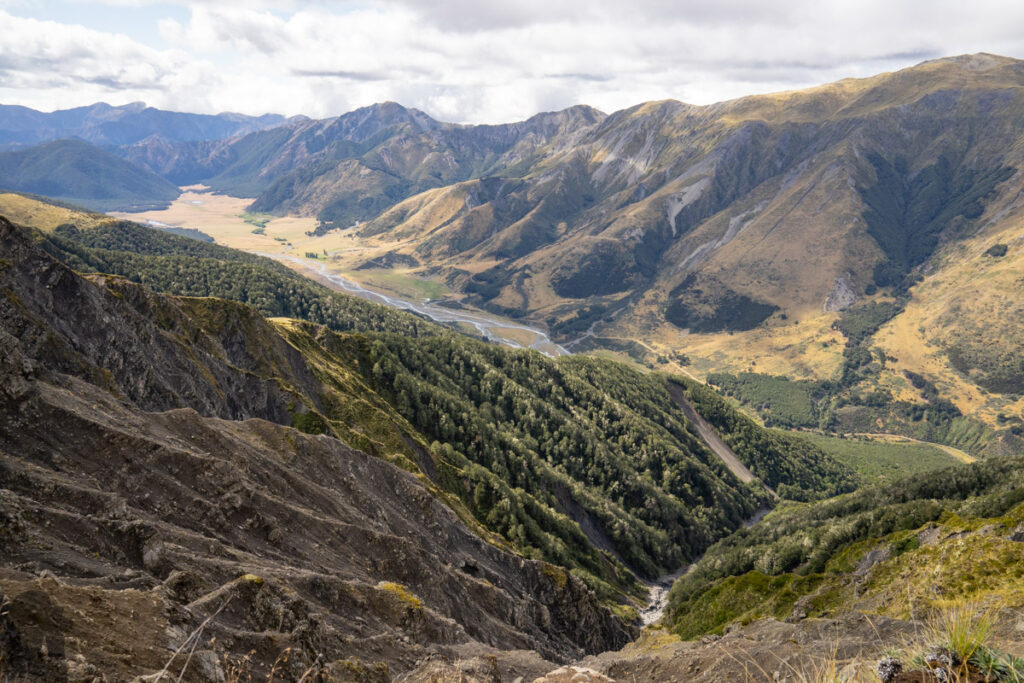 Faust, Libretto Range, Camp by its Colorful Tarns on the Ridge A cliff with Magdalen Valley in the background