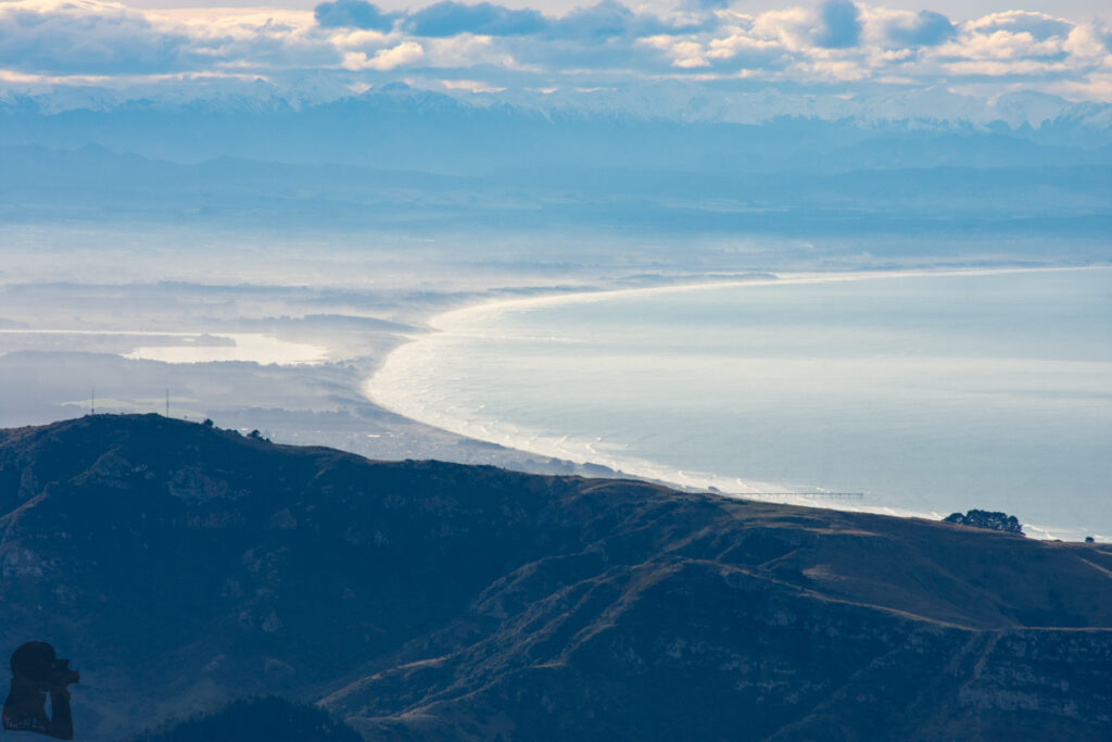 Mount Herbert / Te Ahu Pātiki, Overlooking the Canterbury and Beyond on the Tallest Mountain of Banks Peninsula The coastline of Christchurch with New Brighton Pier sticking out