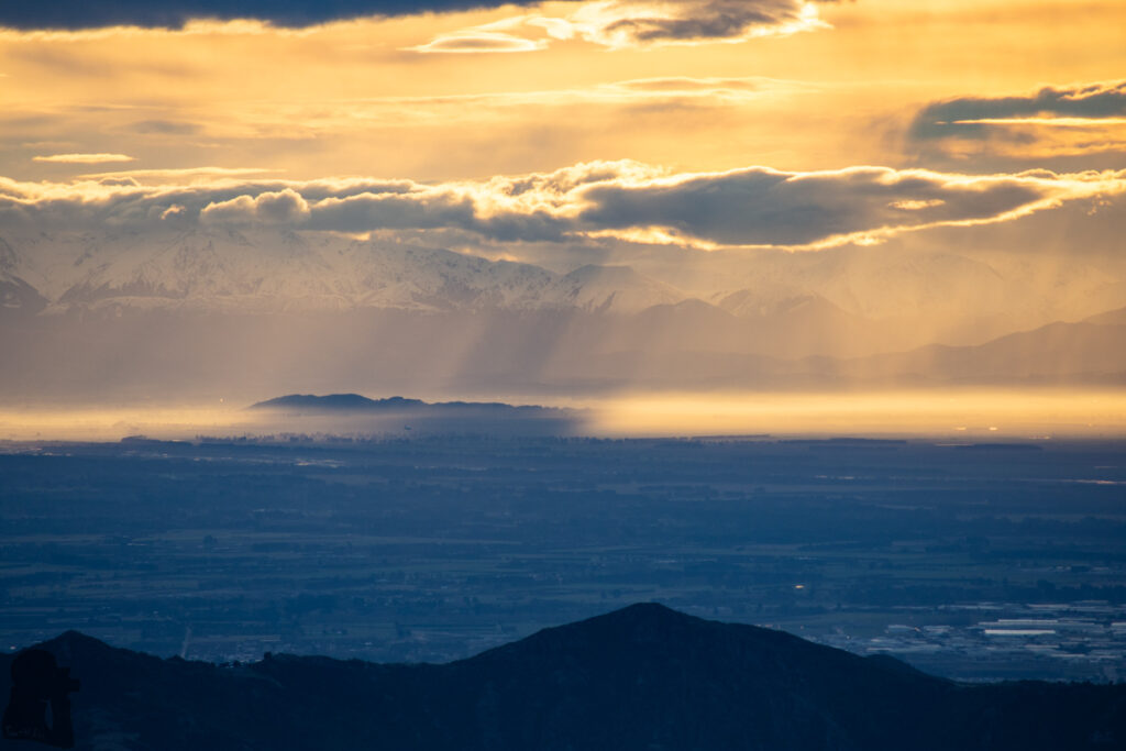 Mount Herbert / Te Ahu Pātiki, Overlooking the Canterbury and Beyond on the Tallest Mountain of Banks Peninsula An airplane was about to land in Christchurch.