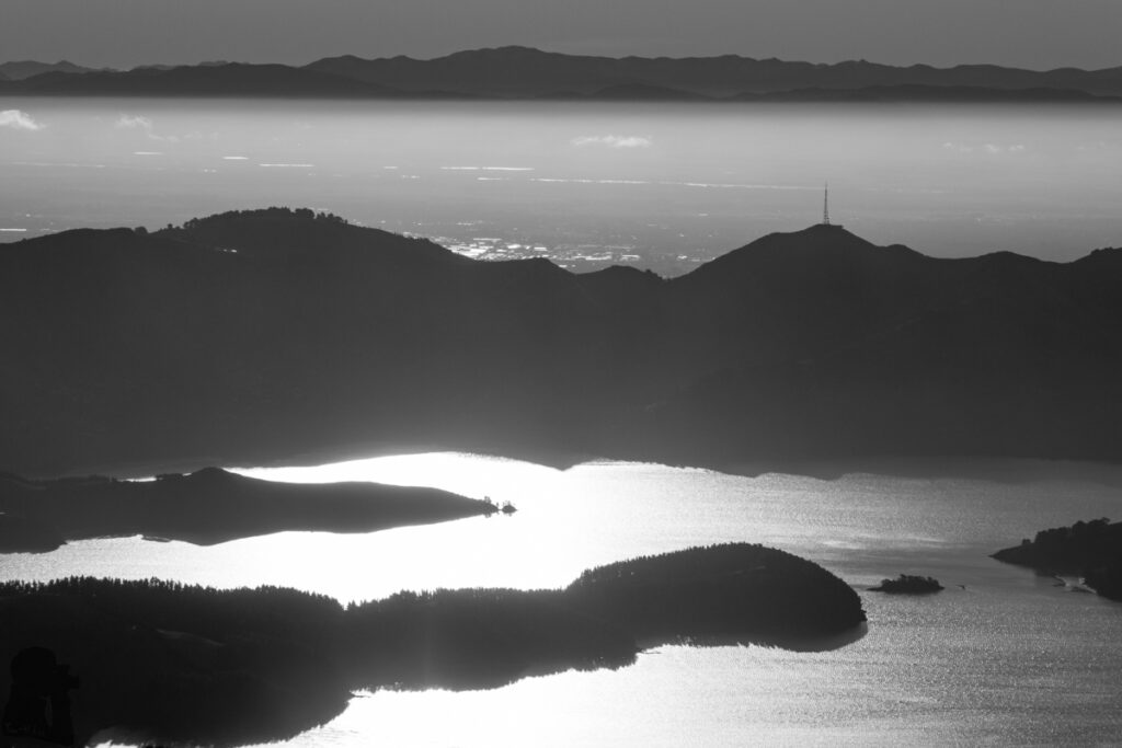 Mount Herbert / Te Ahu Pātiki, Overlooking the Canterbury and Beyond on the Tallest Mountain of Banks Peninsula The intense reflection on the water
