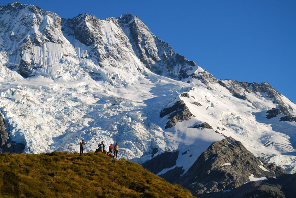 Mueller Hut Route & Mount Ollivier, Climbing High for the Panorama of Hooker Valley and Mount Cook Glaciers around Mt. Sefton towered up behind the hikers who were standing by Sealy Tarns.