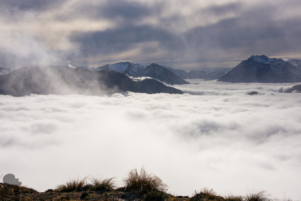 Peak Hill, the Gentle Hill Flanked by the Peaceful Lake Coleridge and Braided Rakaia River The spectacular cloud