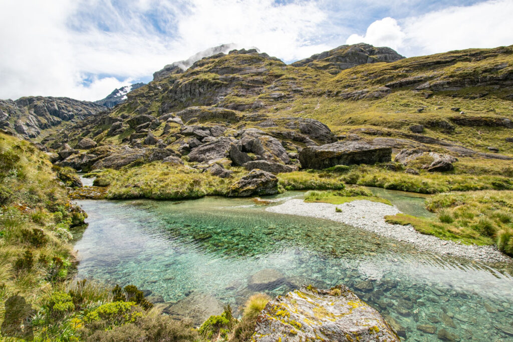 Valley of the Trolls / Lake Wilson, the Best Hidden Destination via Routeburn Track The stream feeds Lake Harris