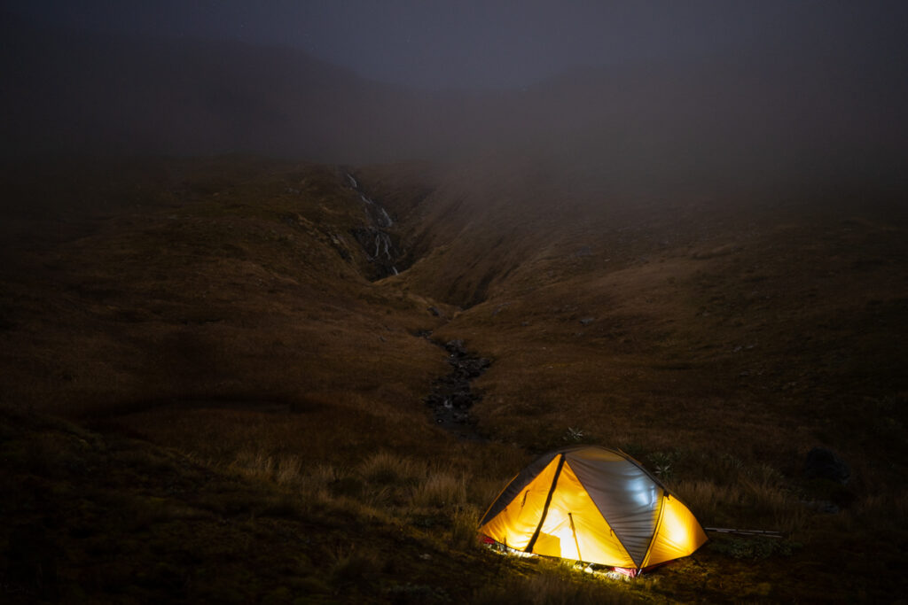 Camping in the Head of Deer Valley, via Lewis Tops Track A lone tent in the landscape