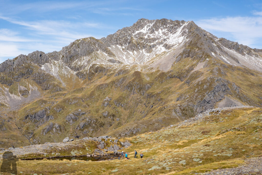 Camping in the Head of Deer Valley, via Lewis Tops Track Mt. Technical dwarfs people in the foreground.