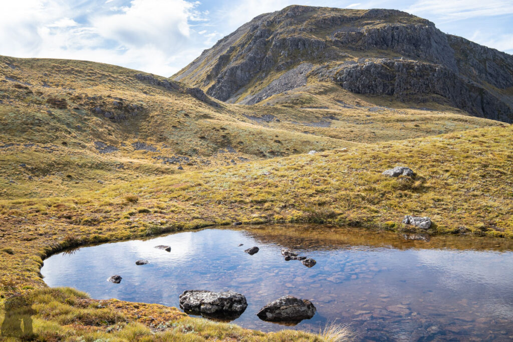 Camping in the Head of Deer Valley, via Lewis Tops Track A tarn near our tent