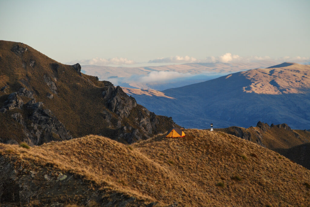Roys Peak, the Summit with Amazing Scenery over Wānaka that No One Will Forget Our tent and a trig point