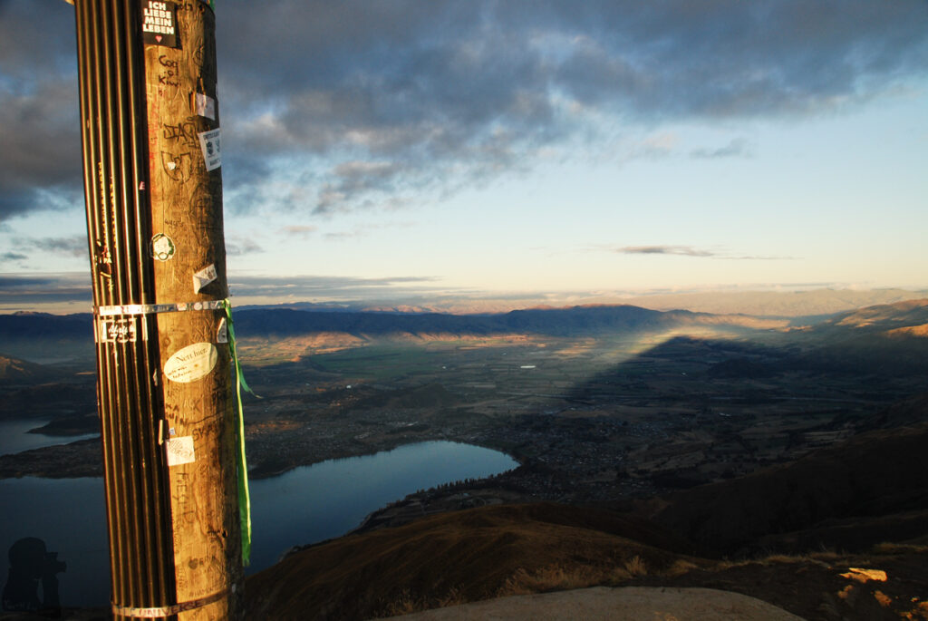 Roys Peak, the Summit with Amazing Scenery over Wānaka that No One Will Forget The pole with all kind of marks and stickers