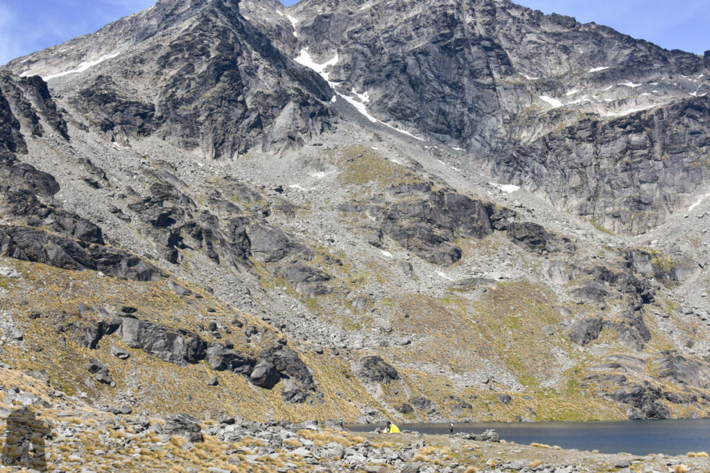 Wye Creek Basin, The Remarkables, Camping by the Gorgeous Lake in a Hidden Valley Campers beside Lake Alta, dwarfed by the sheer face of Double Cone